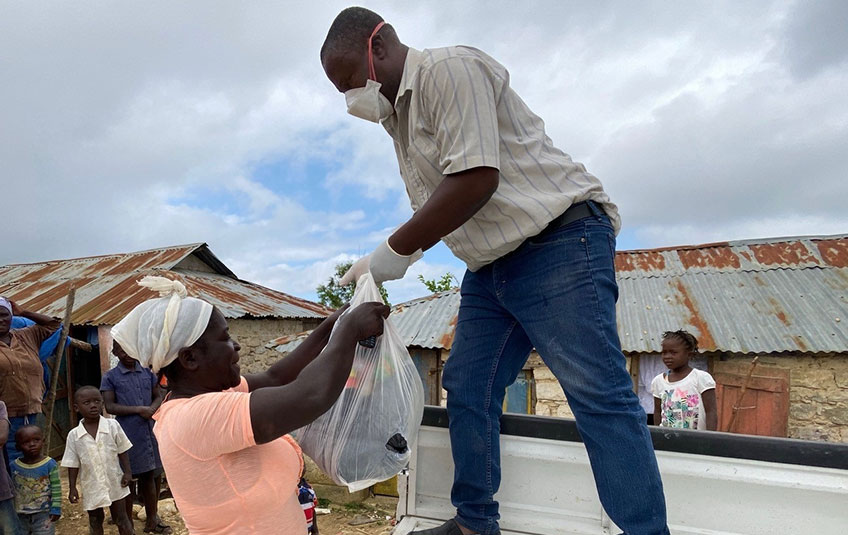 A woman receives FMSC food