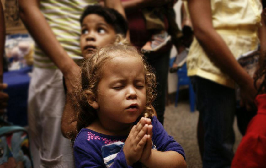 Young girl praying