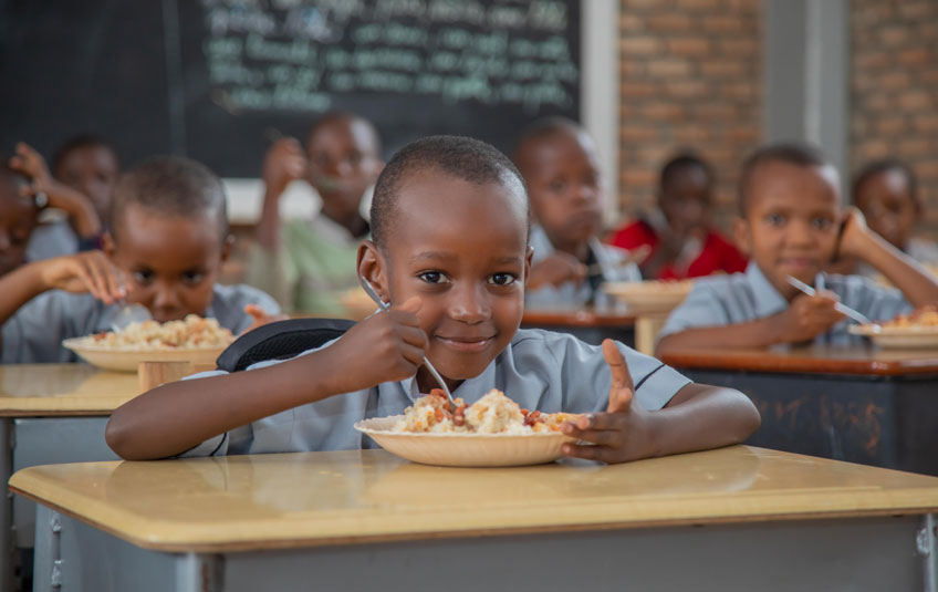 A boy eating FMSC food