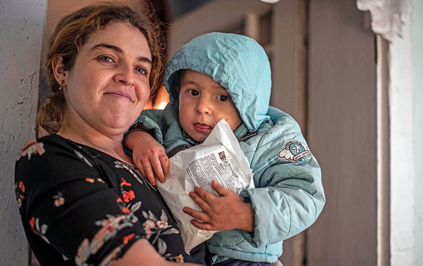 A woman holding a child