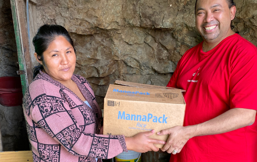 Melida in Peru receiving FMSC meals for her and her family. 