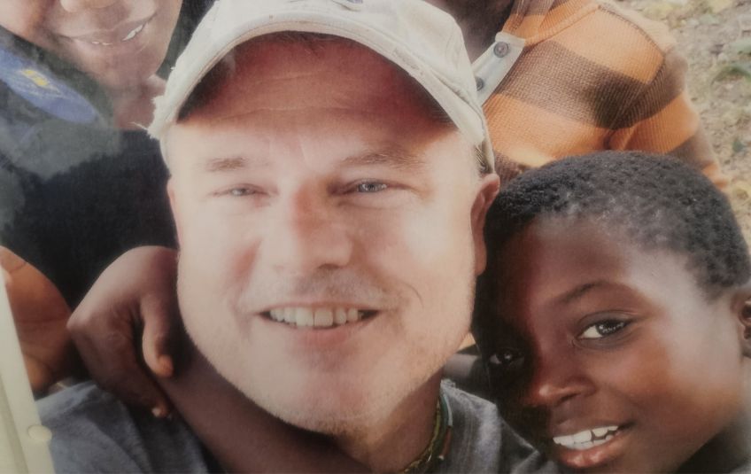Troy Heller and young boy smiling. 