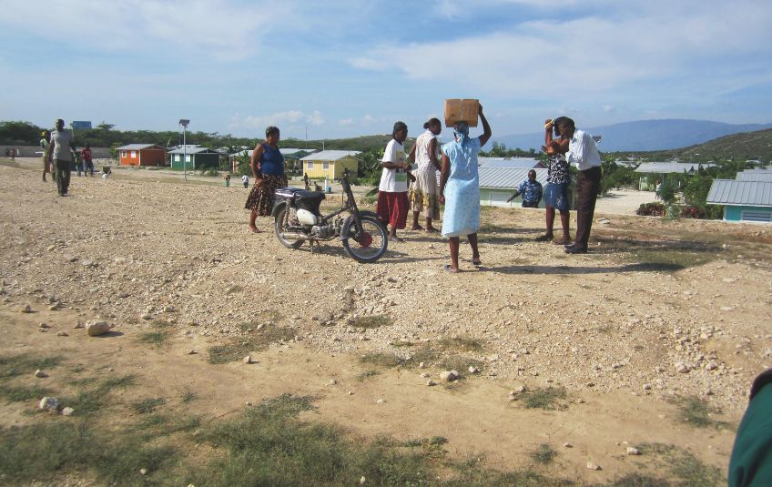 people standing in a barren landscape