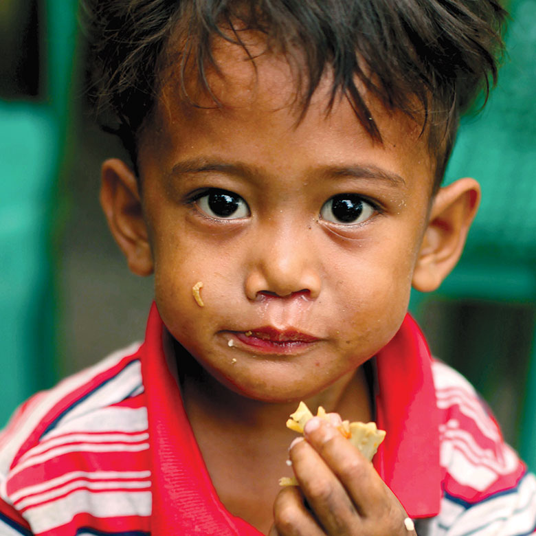 Child eating MannaPack Rice