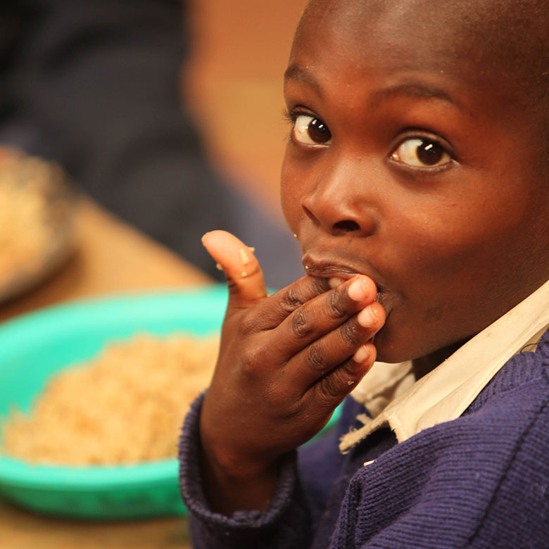 Child eating MannaPack Rice